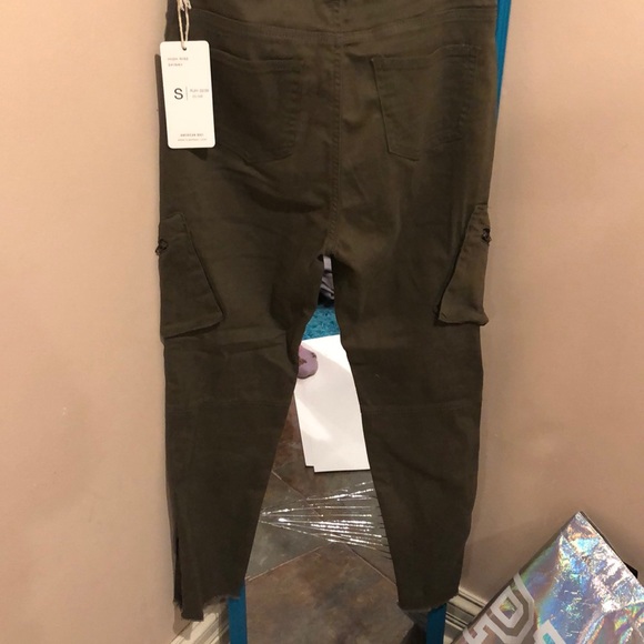 Olive green pants with zippers on the side. - Picture 2 of 2